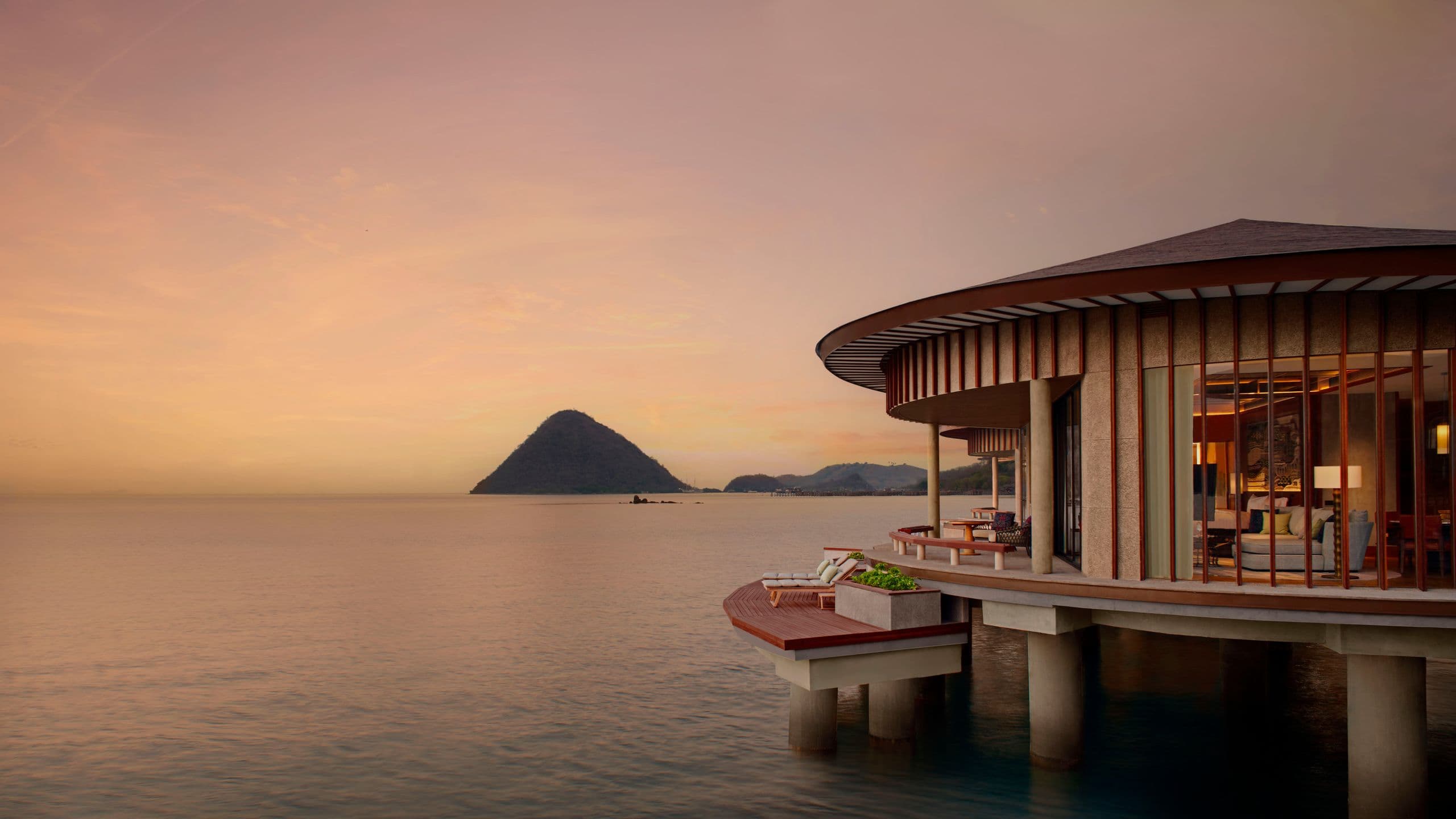A serene overwater villa at sunset